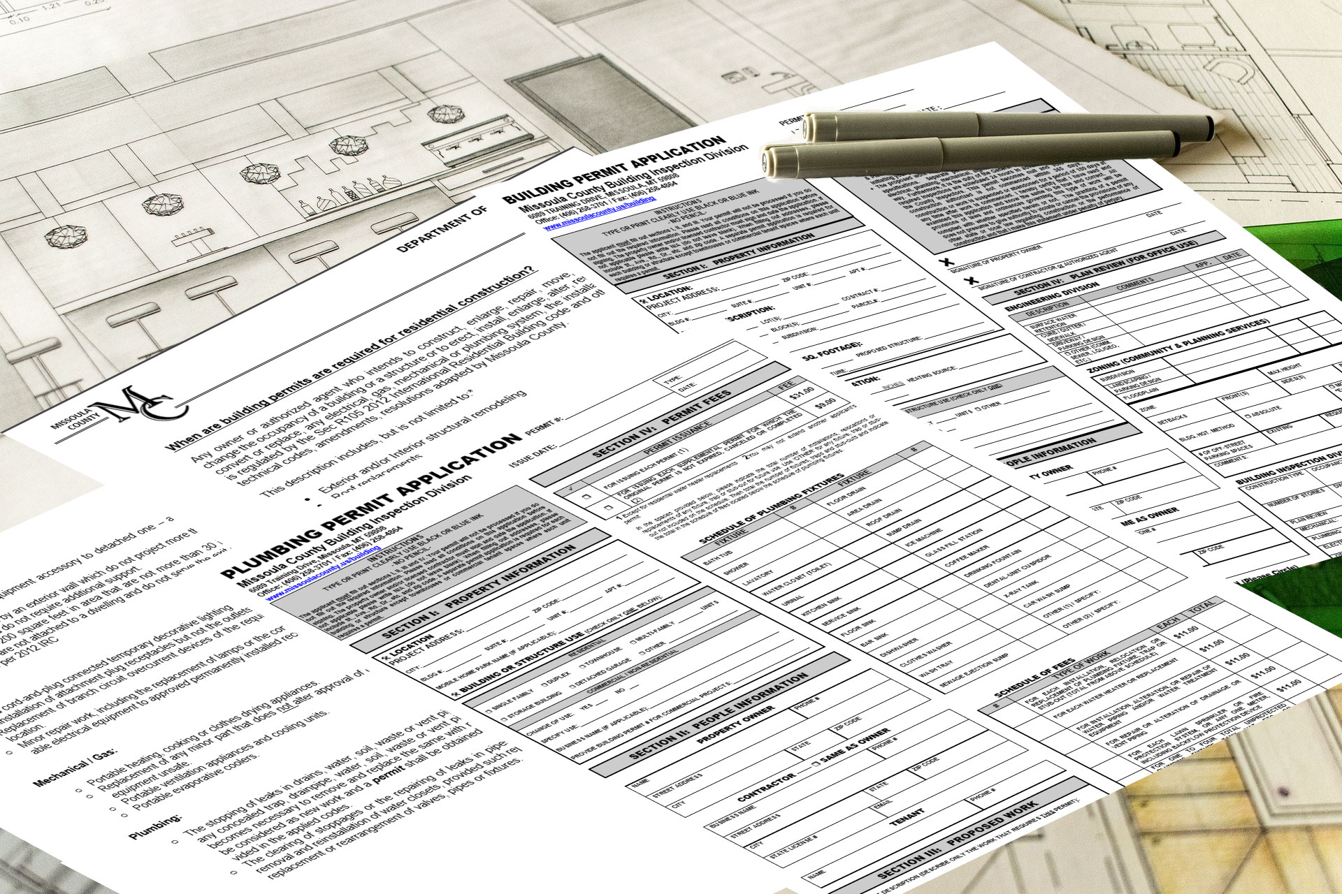 Photograph of various paper Missoula County Permit applications